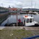 Man in a boat in Dunoon harbour - Fynewood delivery by Cowal Rothesay depot