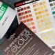 Paint colour chart, brochure and tub of matt paint - painting and decorating supplies